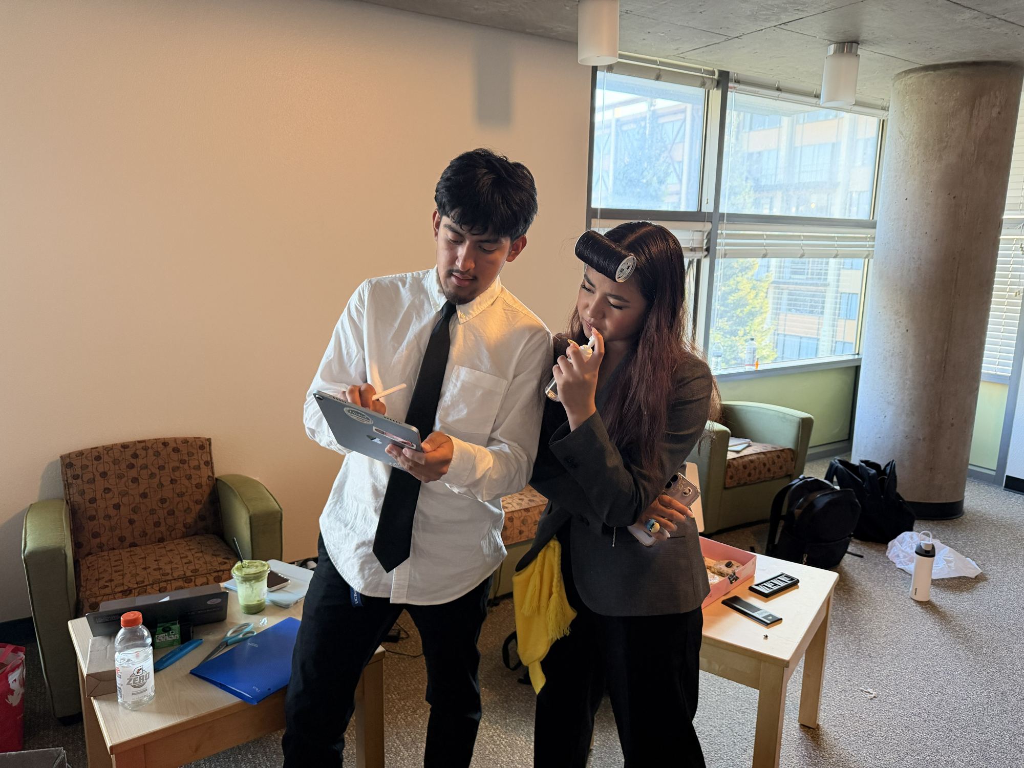 Two team members reviewing plans on a tablet.